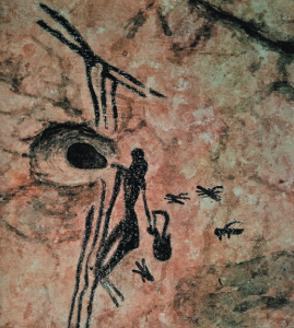 Ilustración o fotografía de la escena prehistórica de recolección de miel en Cuevas de la Araña, España